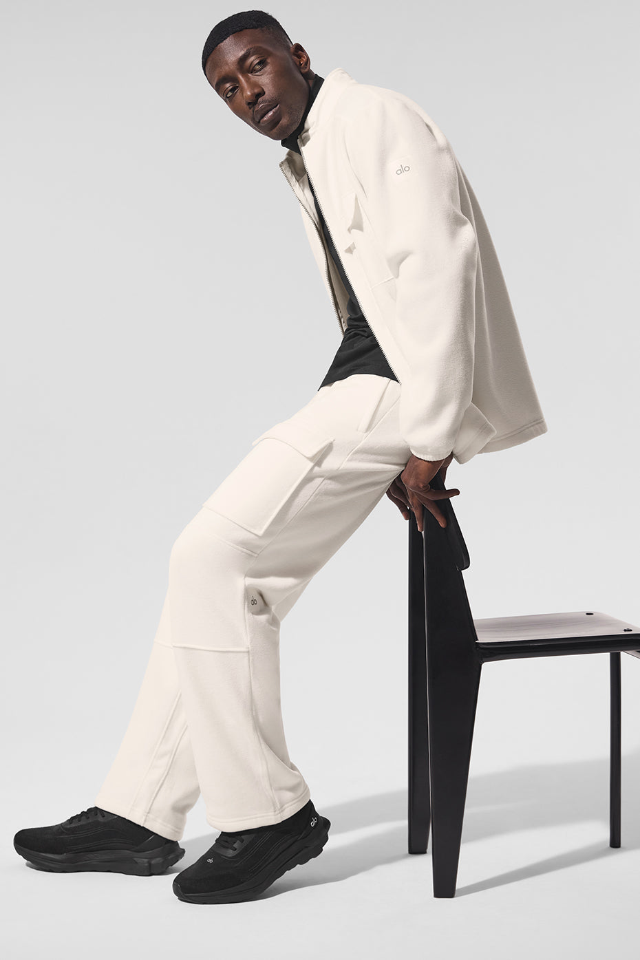 Front view of the ArcticEdge fleece jacket with zippered pockets and tall collar in an outdoor setting