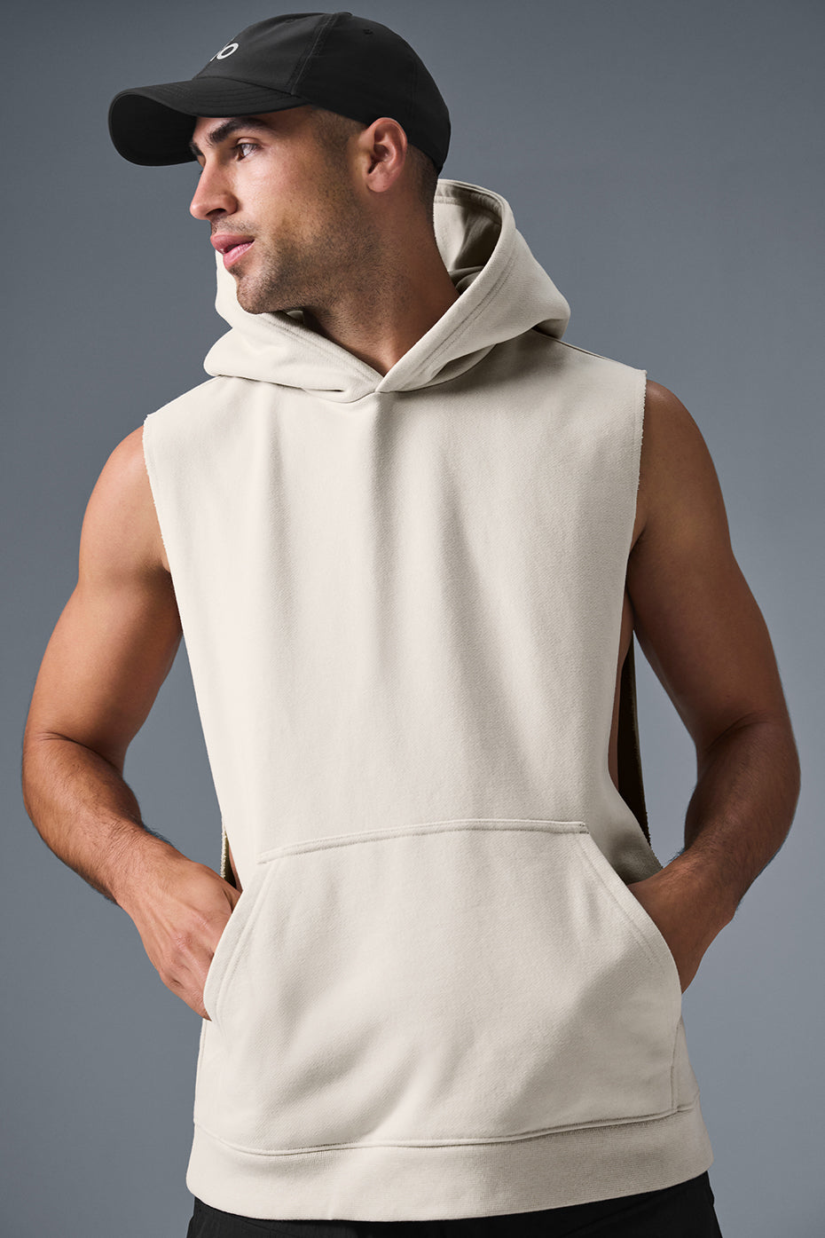 Model wearing the sleeveless hoodie while jogging outdoors