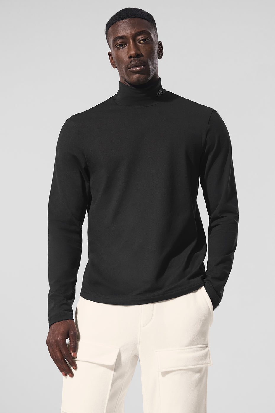 Front view of the black long sleeve shirt with mock neck.