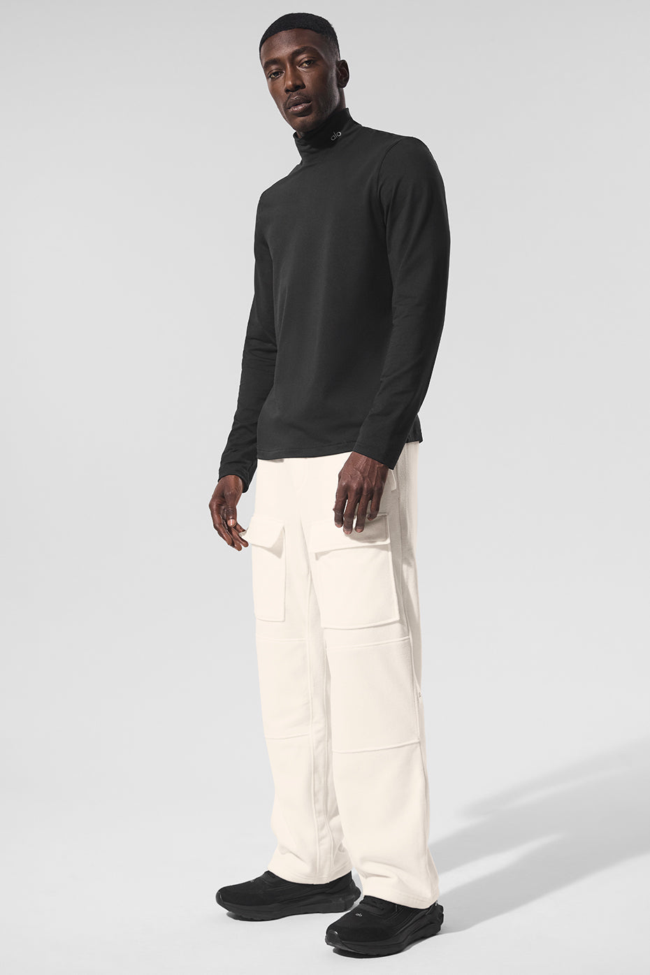 Front view of the black long sleeve shirt with mock neck.
