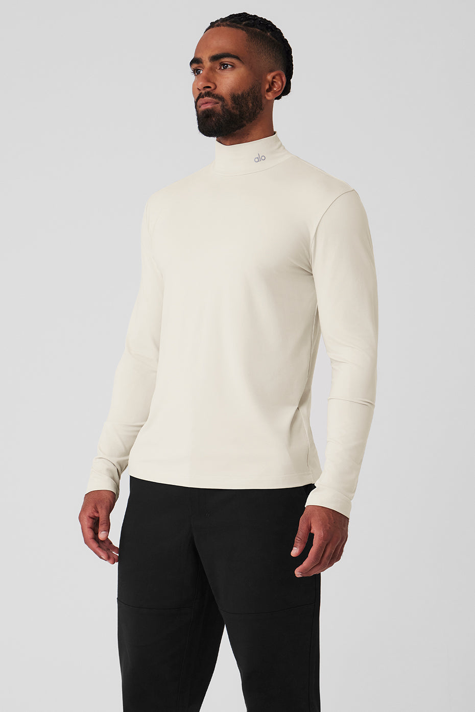 Model wearing the sleek long sleeve top with mock neck, demonstrating its fit and versatility