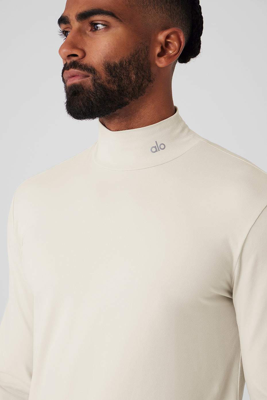 Front view of Conquer Reform mock neck long sleeve top in bone color, highlighting the modern design