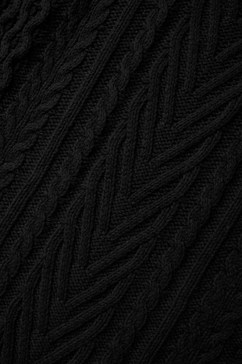 Model wearing black sweater dress with cable knit details for fall fashion