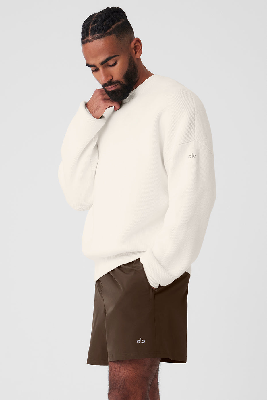 Close-up of ribbed detailing on the crew neck sweater.