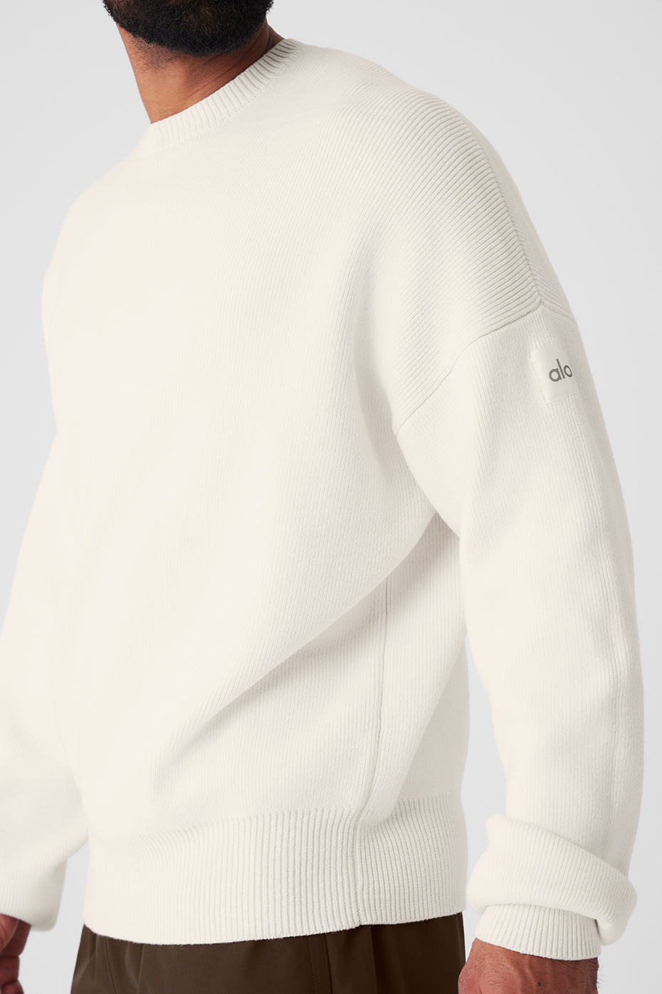 Front view of oversized cotton sweater in ivory color.