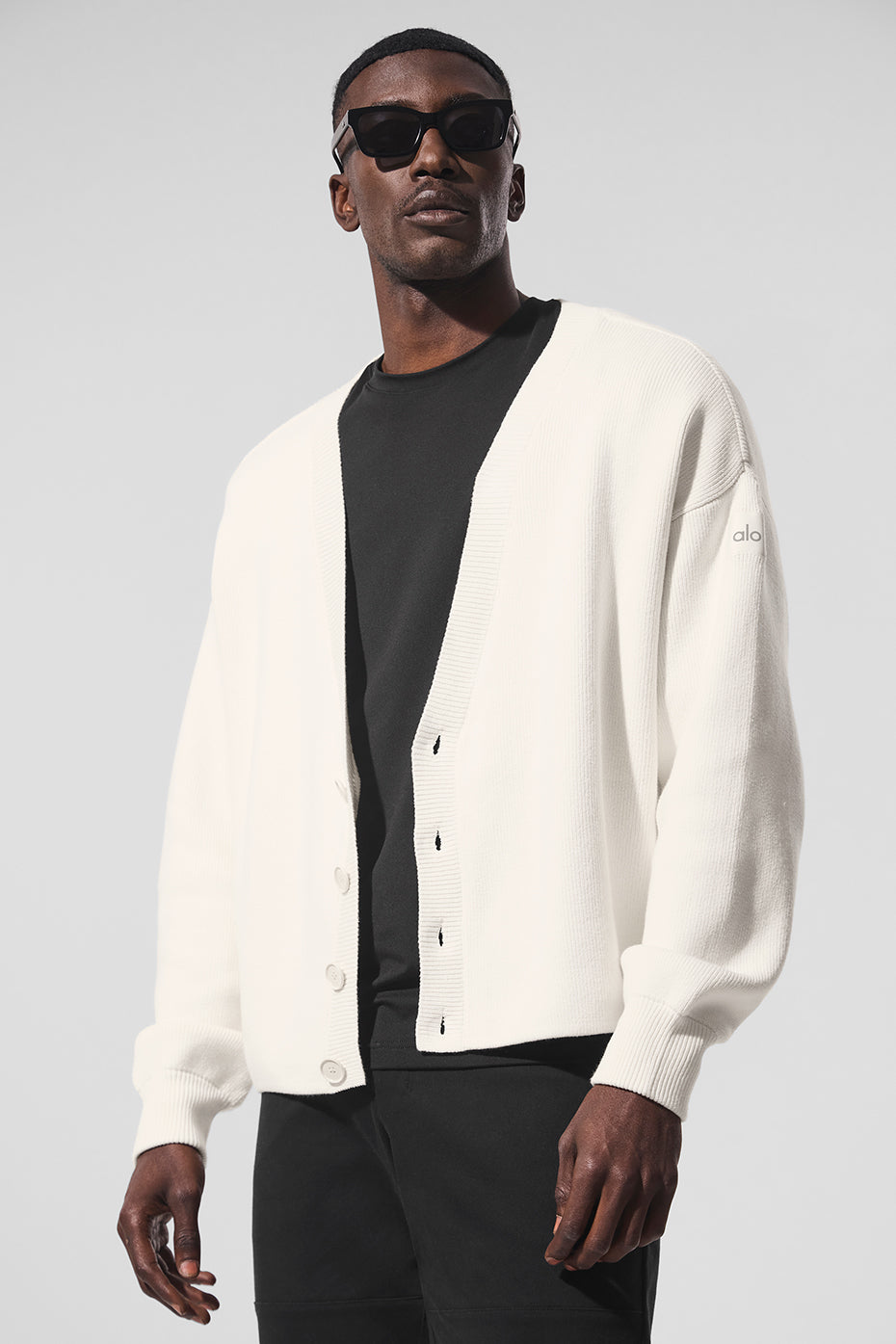 Front view of the Scholar ivory cardigan sweater styled over a basic tee