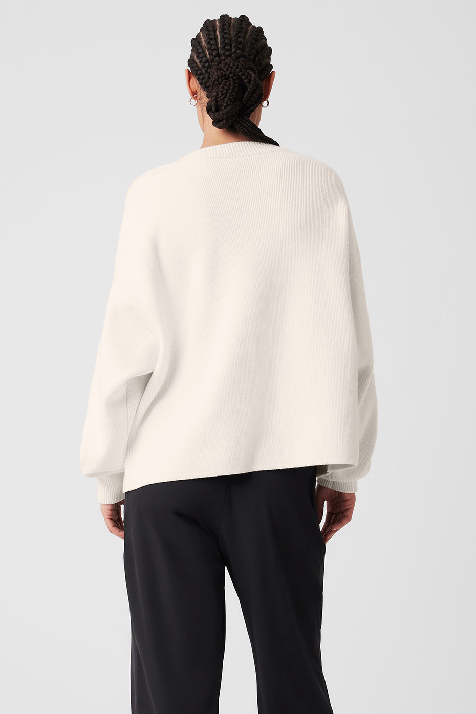 Close-up of the ribbed cuffs and button details on the cardigan