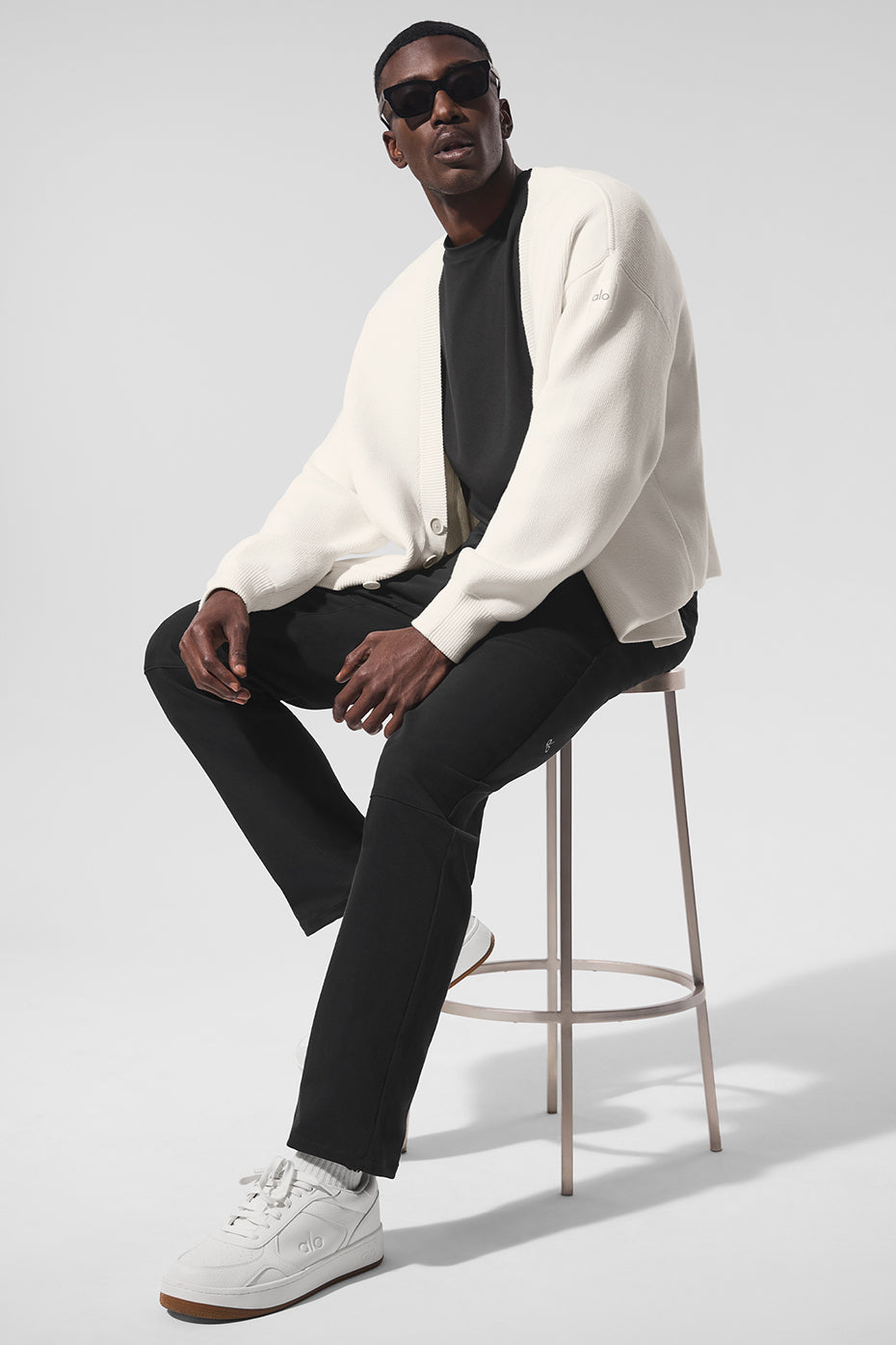 Front view of the Scholar ivory cardigan sweater styled over a basic tee