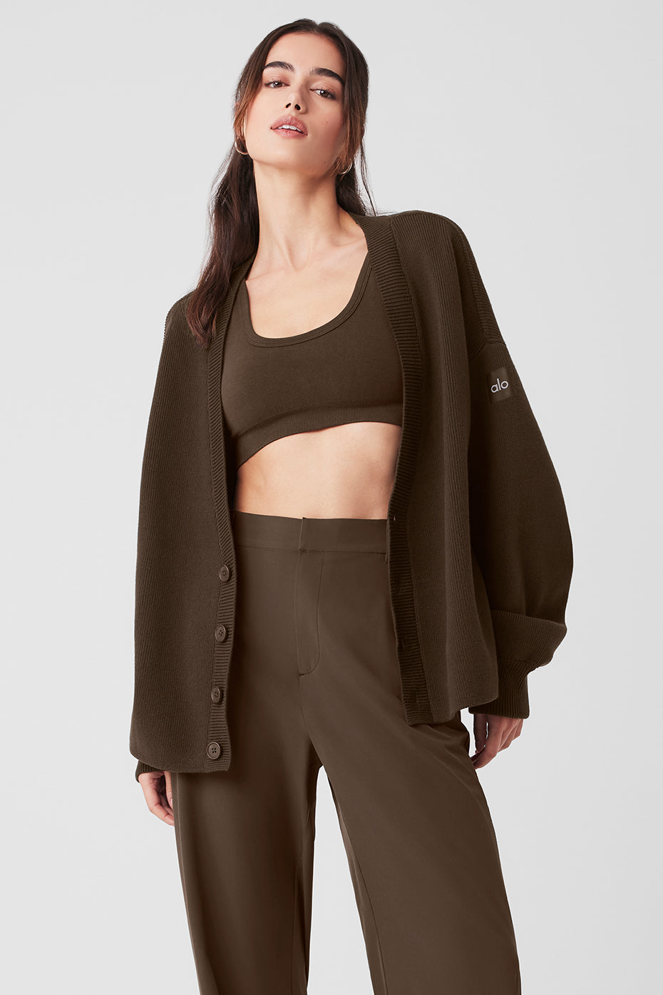 Scholar oversized cashmere cardigan in espresso, styled with workout wear.