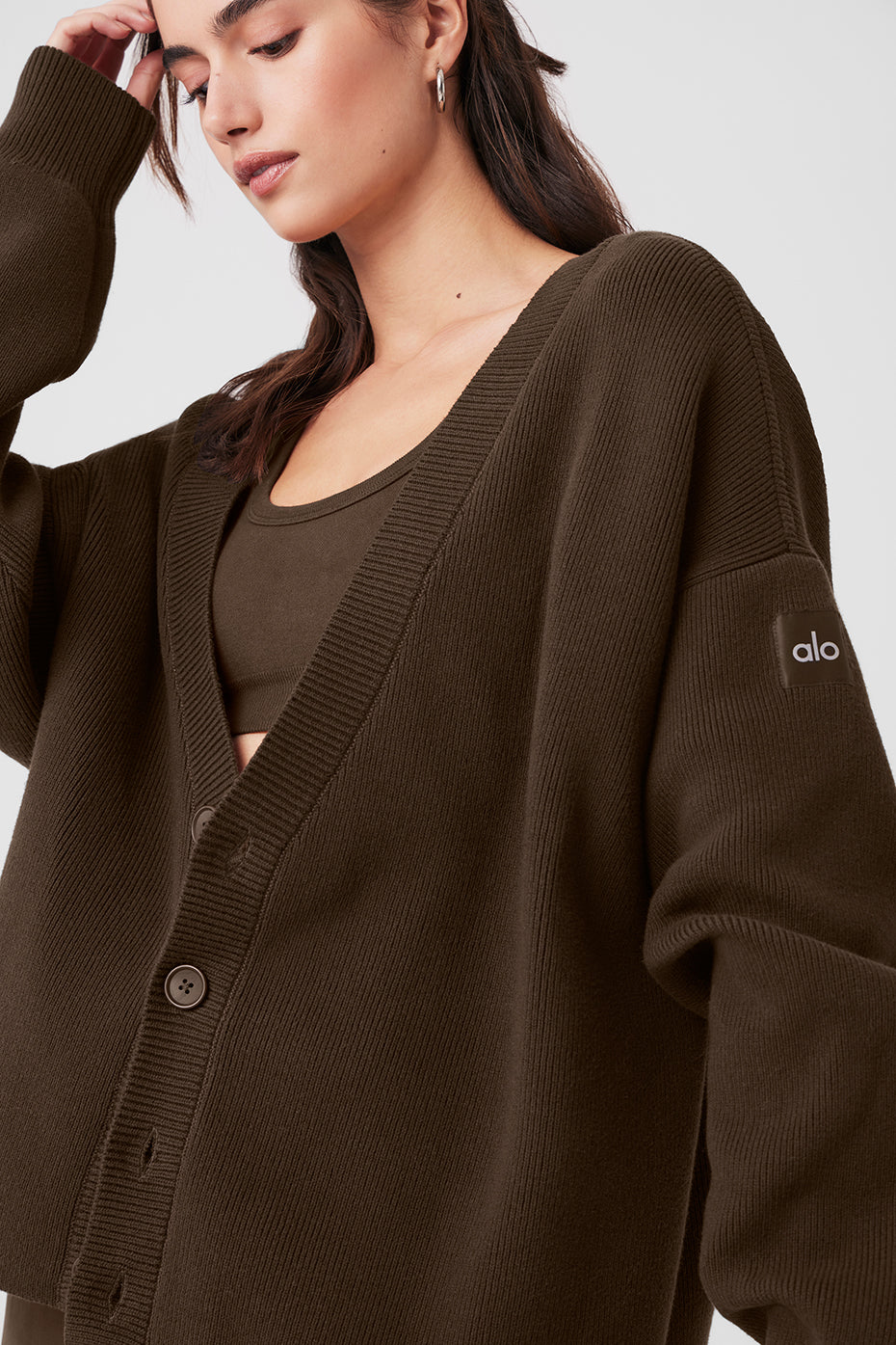 Scholar oversized cashmere cardigan in espresso, styled with workout wear.
