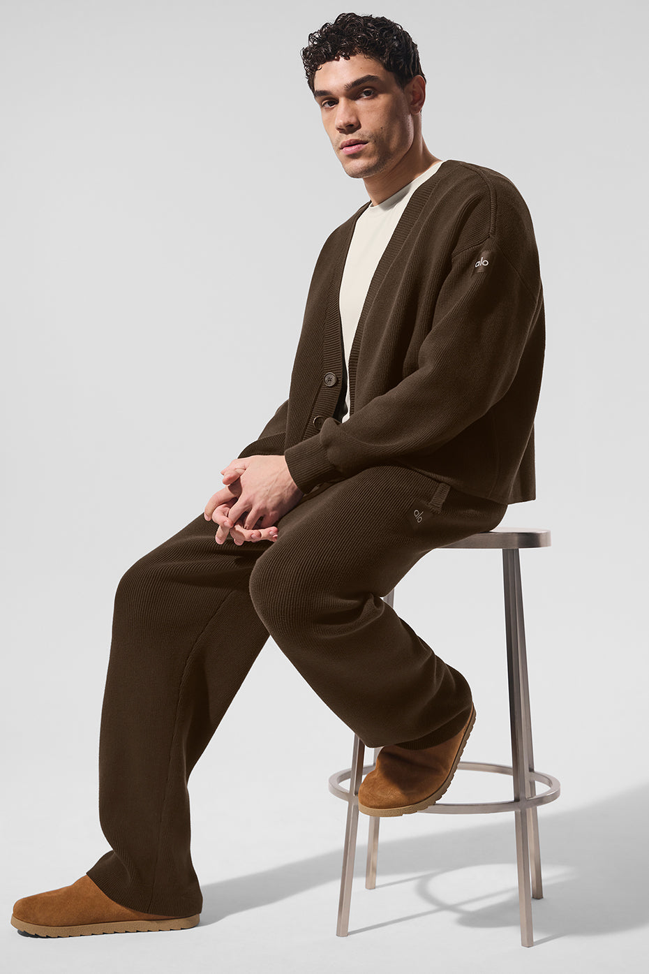 Front view of espresso cardigan sweater styled over a white tee