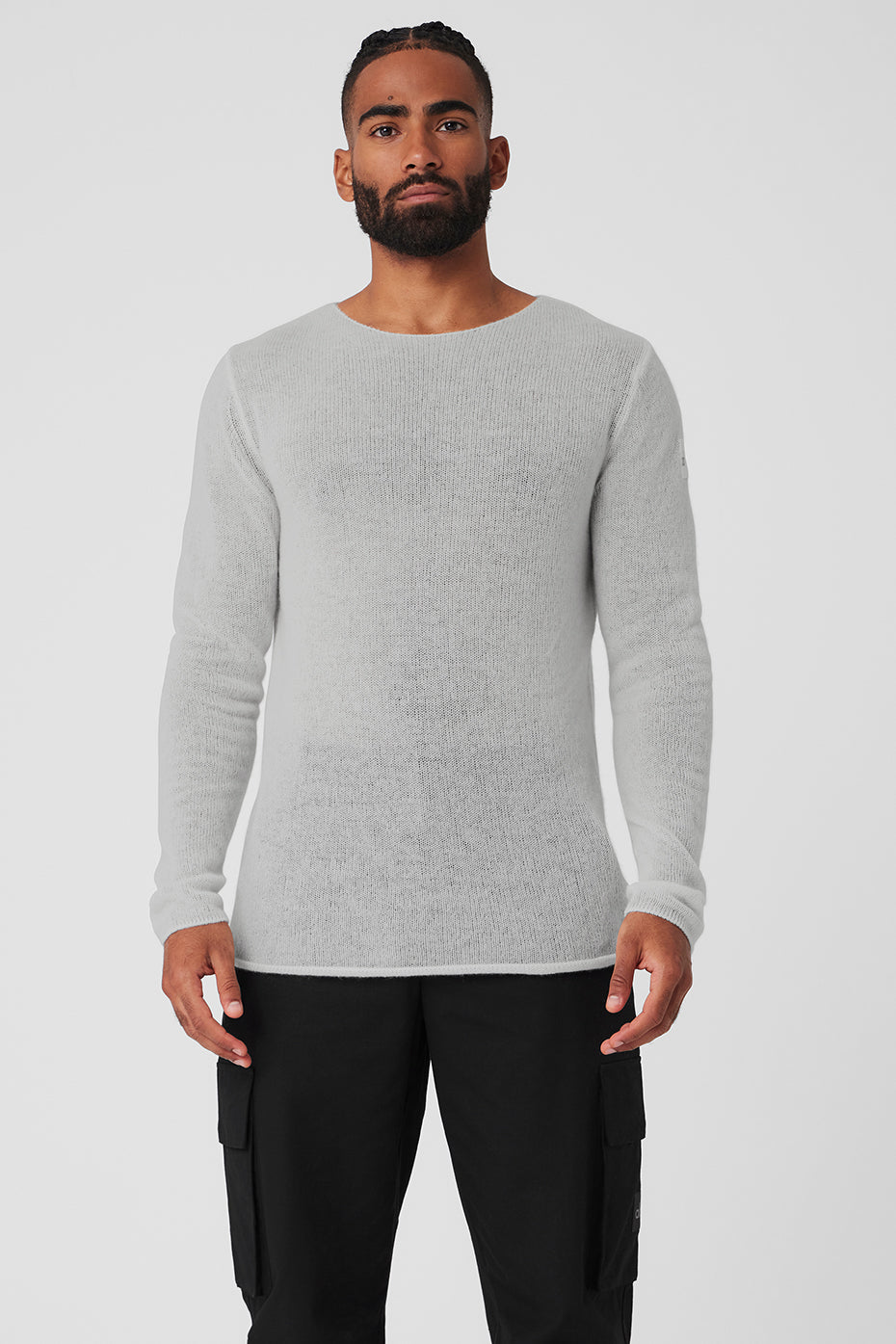 Front view of men's cashmere sweater in heather grey, layered over a white tee