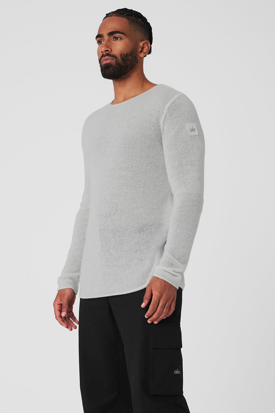 Outdoor setting with model wearing the cashmere long sleeve polo under a wool jacket