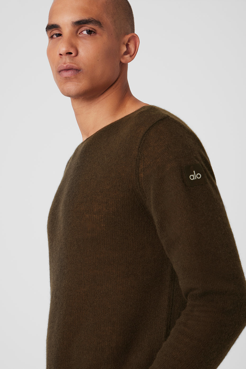 Close-up of the espresso cashmere long sleeve sweater showcasing its soft texture.