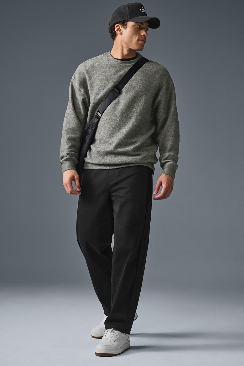 Woman wearing the oversized sweatshirt with relaxed sleeves and a casual fit.