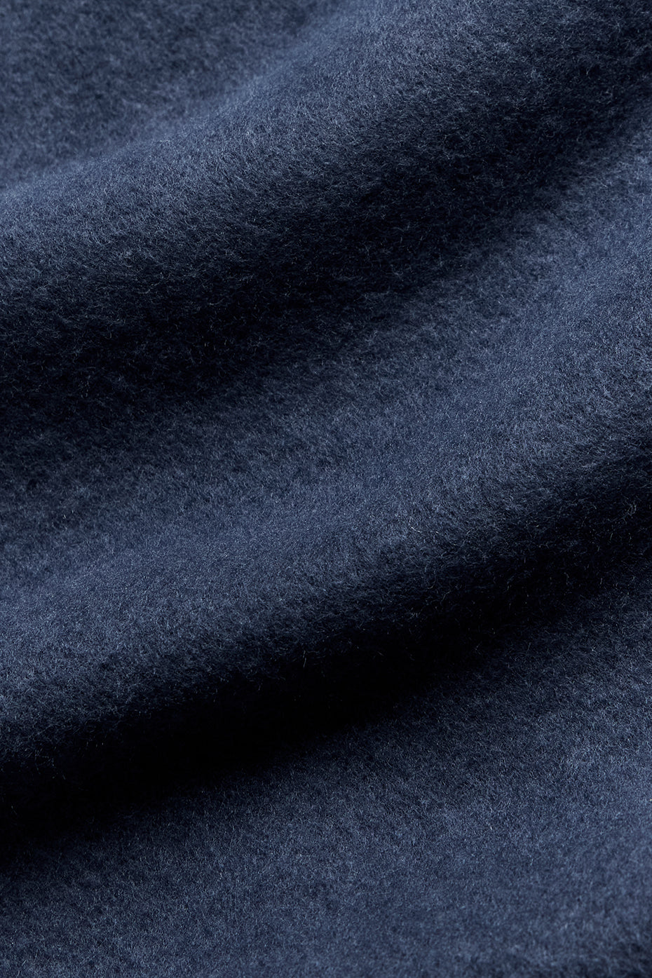 Side angle showing the relaxed fit of the navy crew neck sweatshirt.