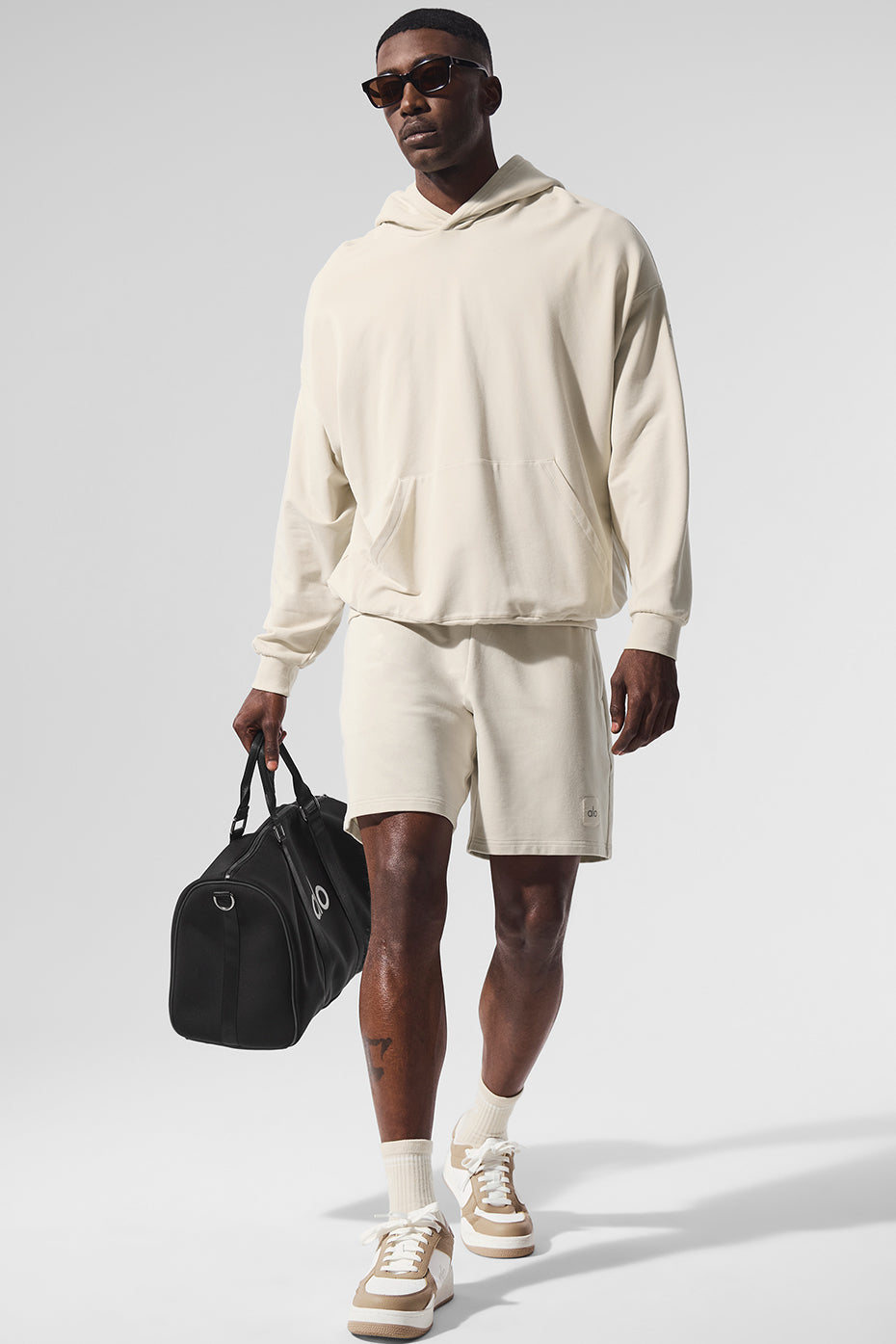Front view of the Essence Comfort Hoodie in Bone, showcasing its relaxed fit and kangaroo pocket.