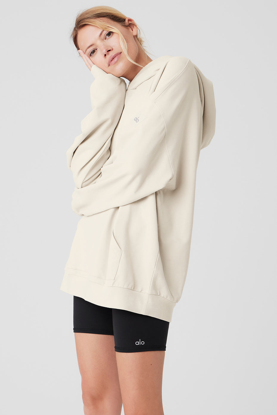 Back view of the Essential Comfort Hoodie, emphasizing the banded cuffs and hem.