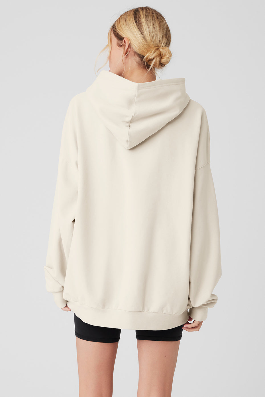 Side view of the Essential Comfort Hoodie, highlighting the dropped shoulders and kangaroo pocket.