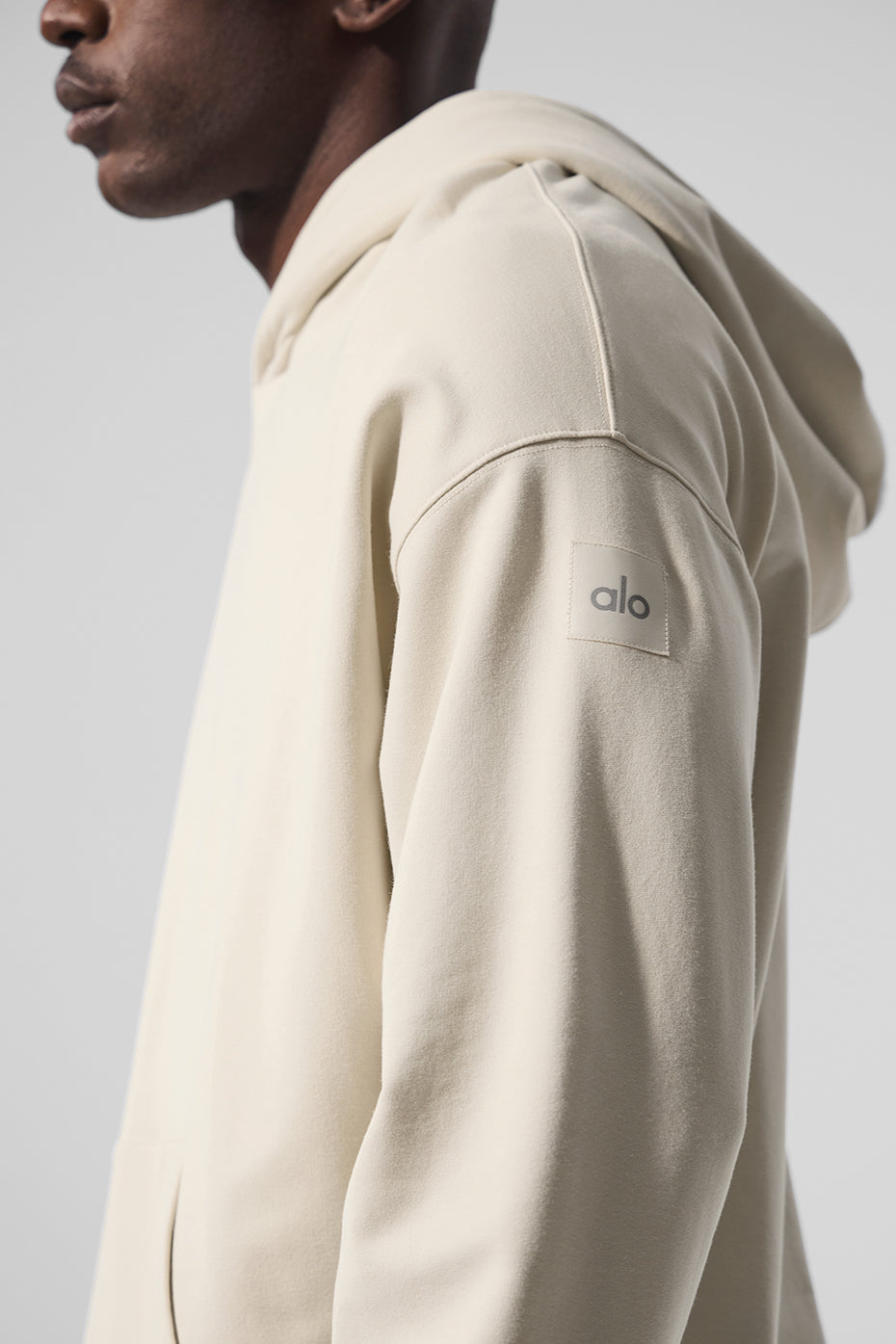 Front view of the Essence Comfort Hoodie in Bone, showcasing its relaxed fit and kangaroo pocket.