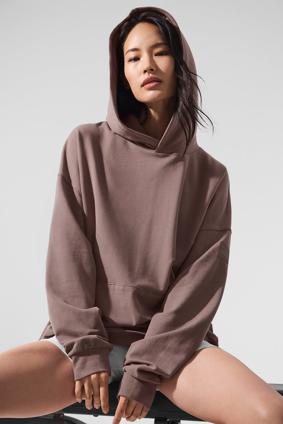 Mushroom Comfort Hoodie displayed in a stylish outdoor setting.