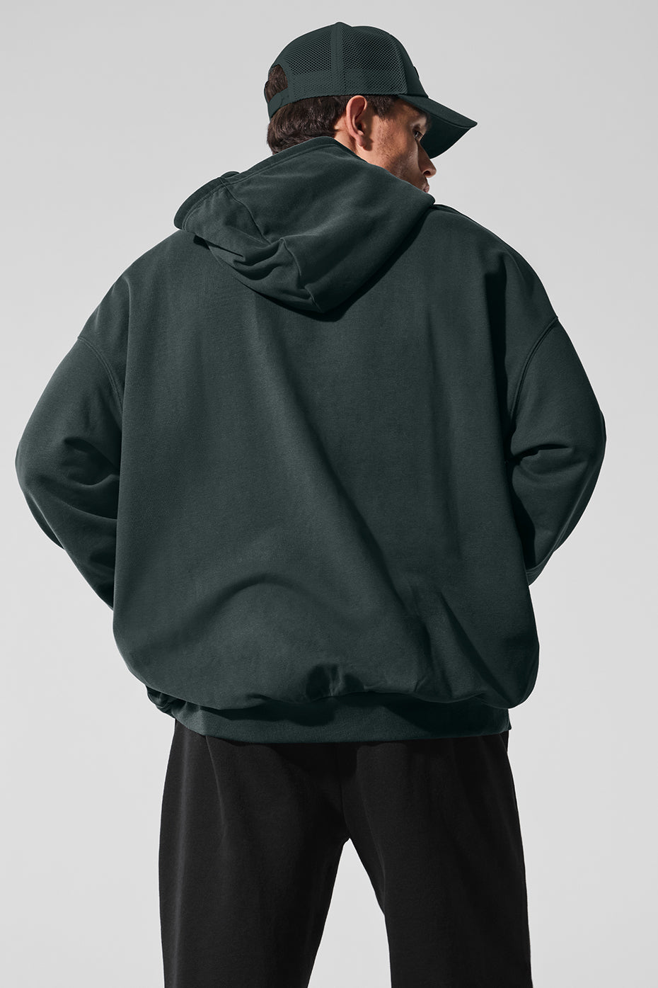 Model wearing the mens hoodie in a street setting, demonstrating casual style