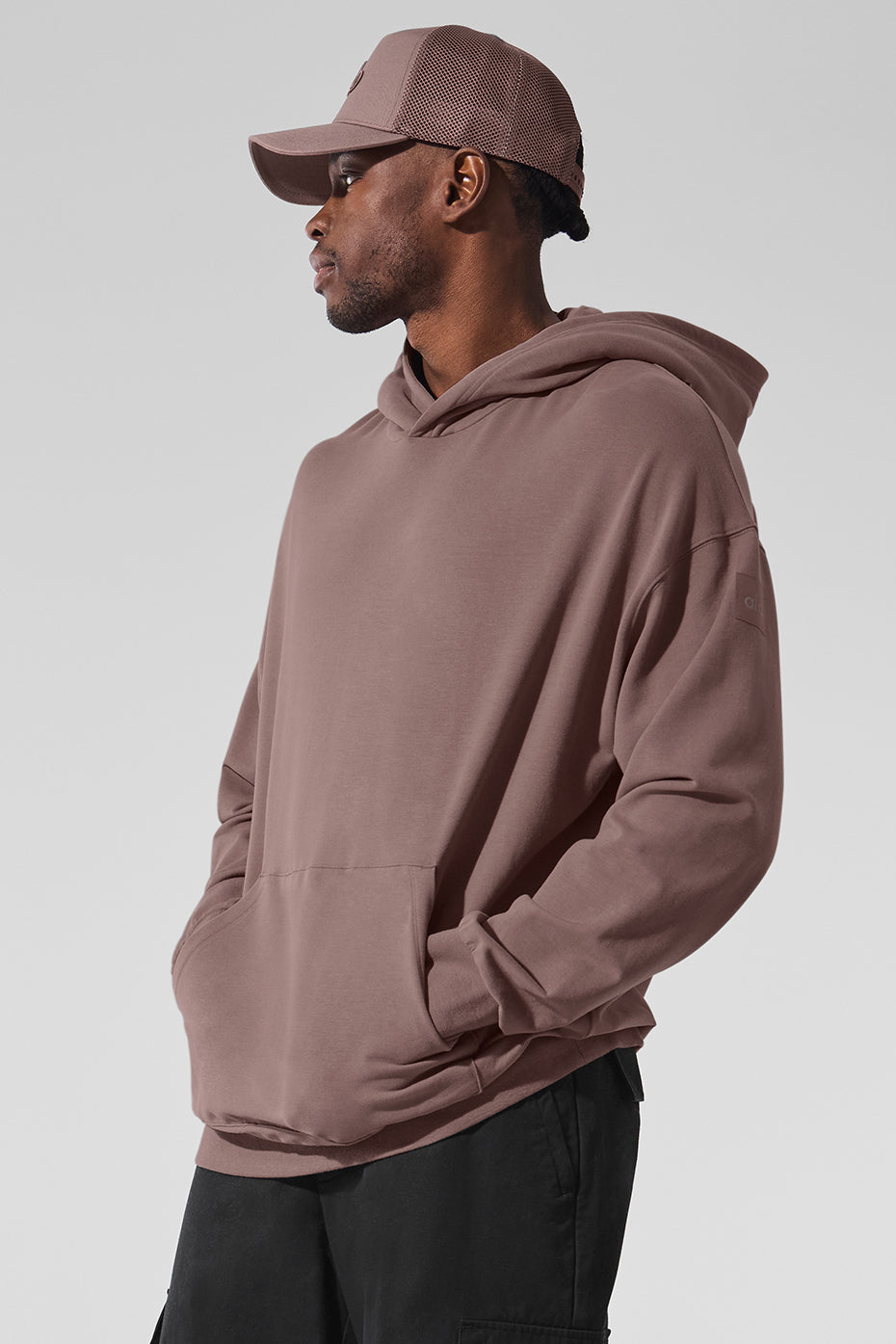 Close-up of the banded cuffs and kangaroo pocket on the hoodie