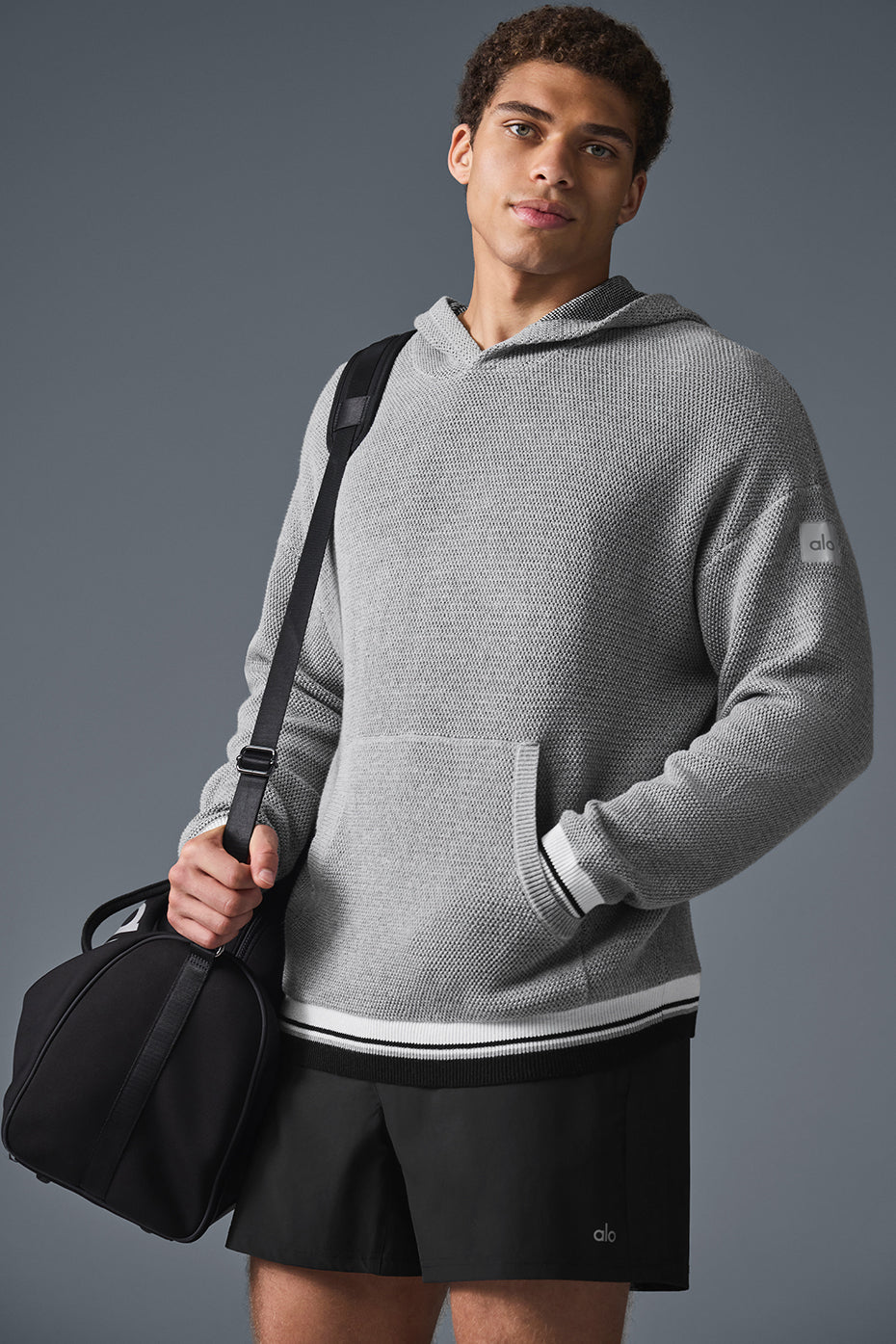 Front view of the pink palm puff hoodie highlighting its trendy design and textured fabric
