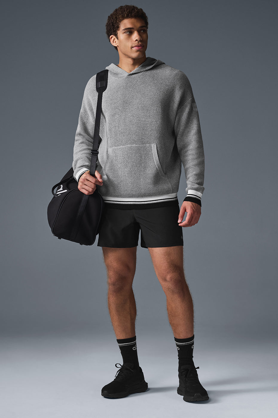 Front view of the pink palm puff hoodie highlighting its trendy design and textured fabric