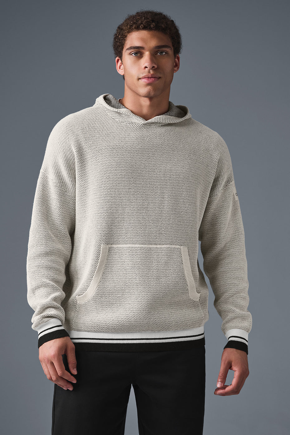 Close-up of varsity striped cuffs on sports hoodie, ideal for layering