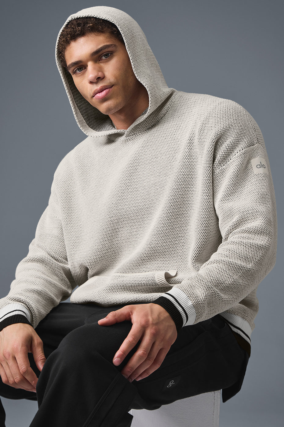 Close-up of varsity striped cuffs on sports hoodie, ideal for layering