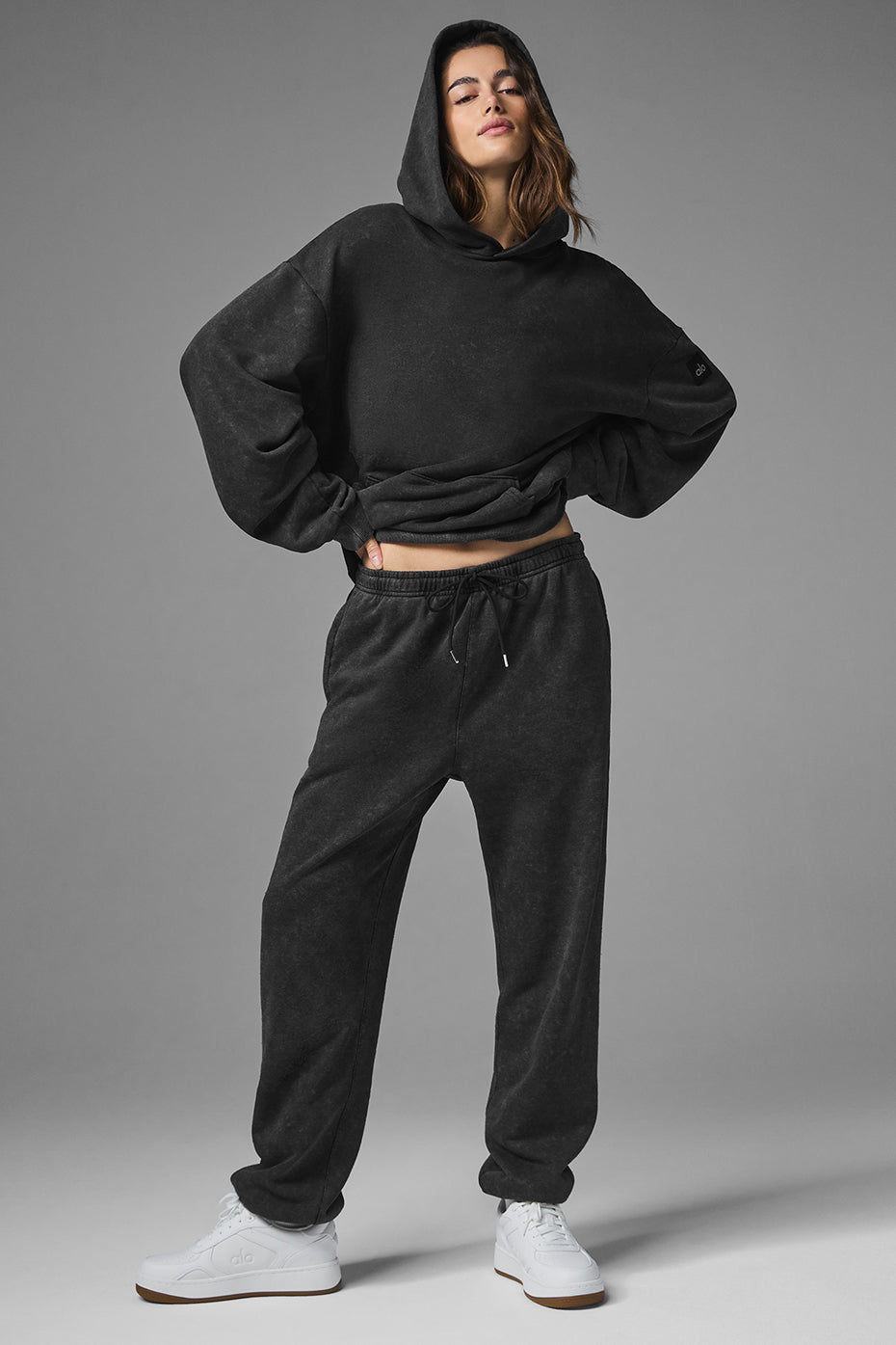 Front view of oversized black zip up hoodie with vintage wash