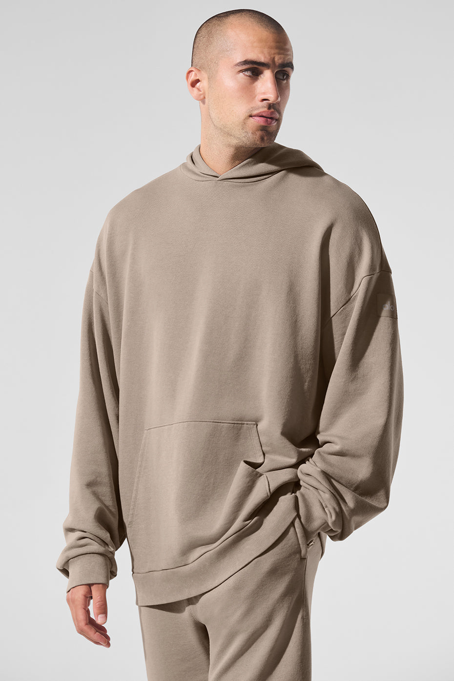 Front view of vintage wash hoodie with oversized fit and large front pocket
