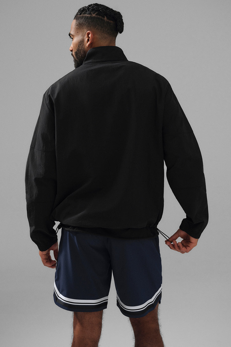 Front view of mens lightweight pullover showcasing zippered pockets and adjustable hem