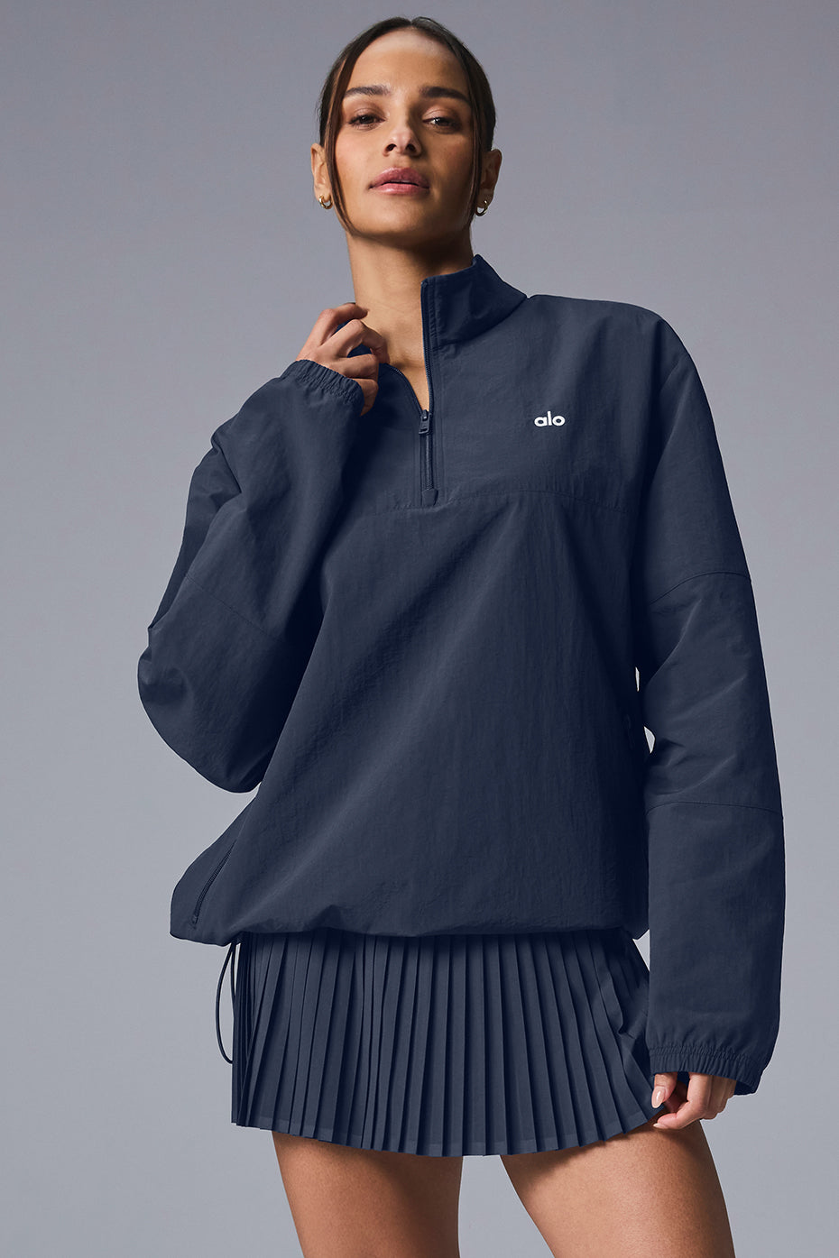 Navy lightweight quarter zip pullover showcasing relaxed fit and zippered pockets.