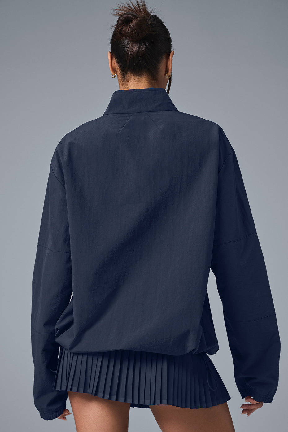 Close-up of the quarter zip neck on a lightweight pullover, ideal for running.