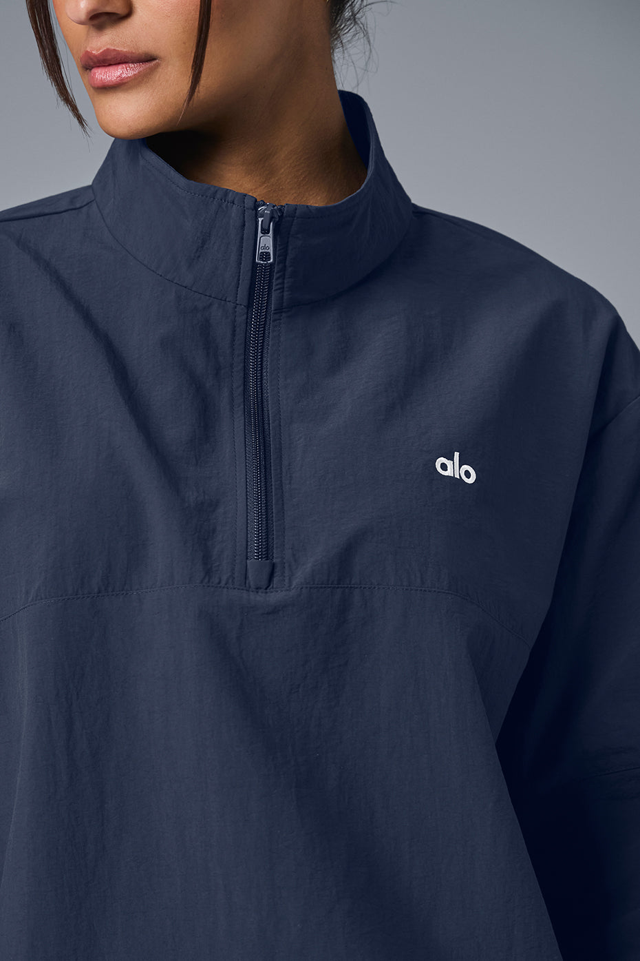 Model wearing a navy quarter zip workout top, perfect for casual outings.