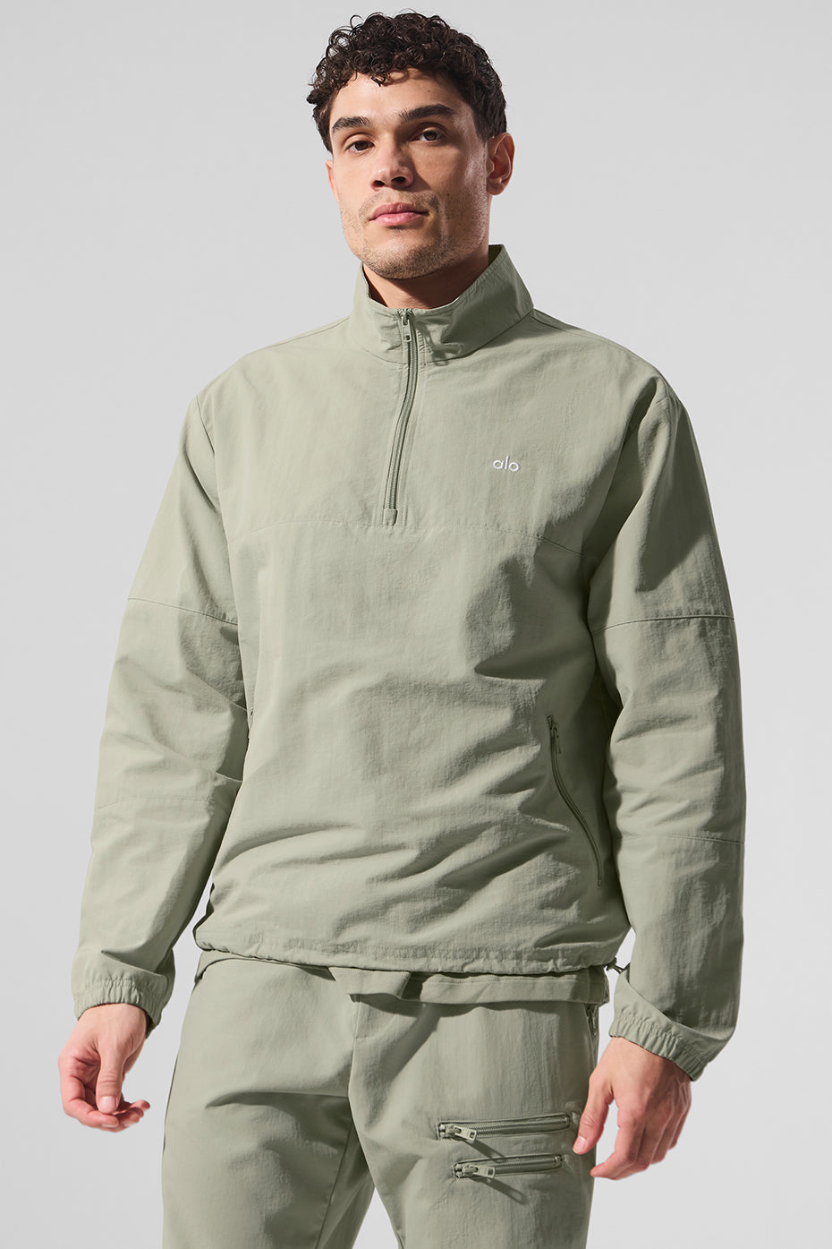 Front view of the lightweight quarter zip pullover in limestone, showcasing the relaxed fit.