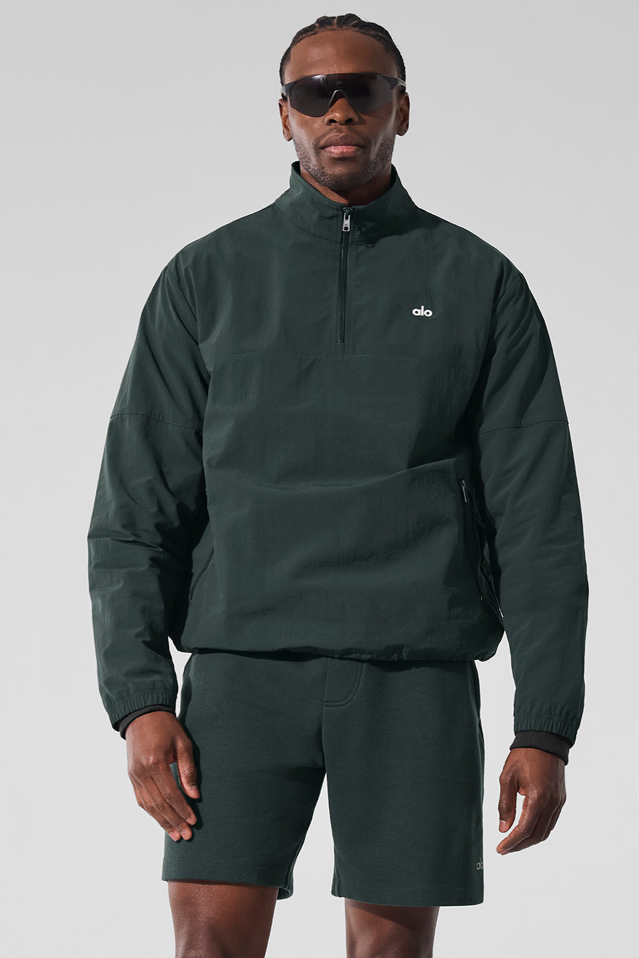 Front view of lightweight takeaway track pullover styled for urban spring layers