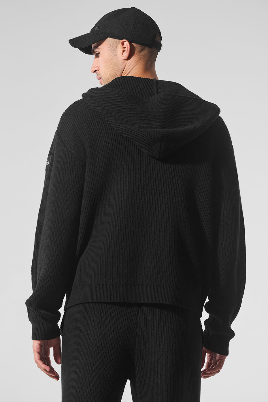 Back view of the full zip sweater men, demonstrating its comfortable oversized silhouette.