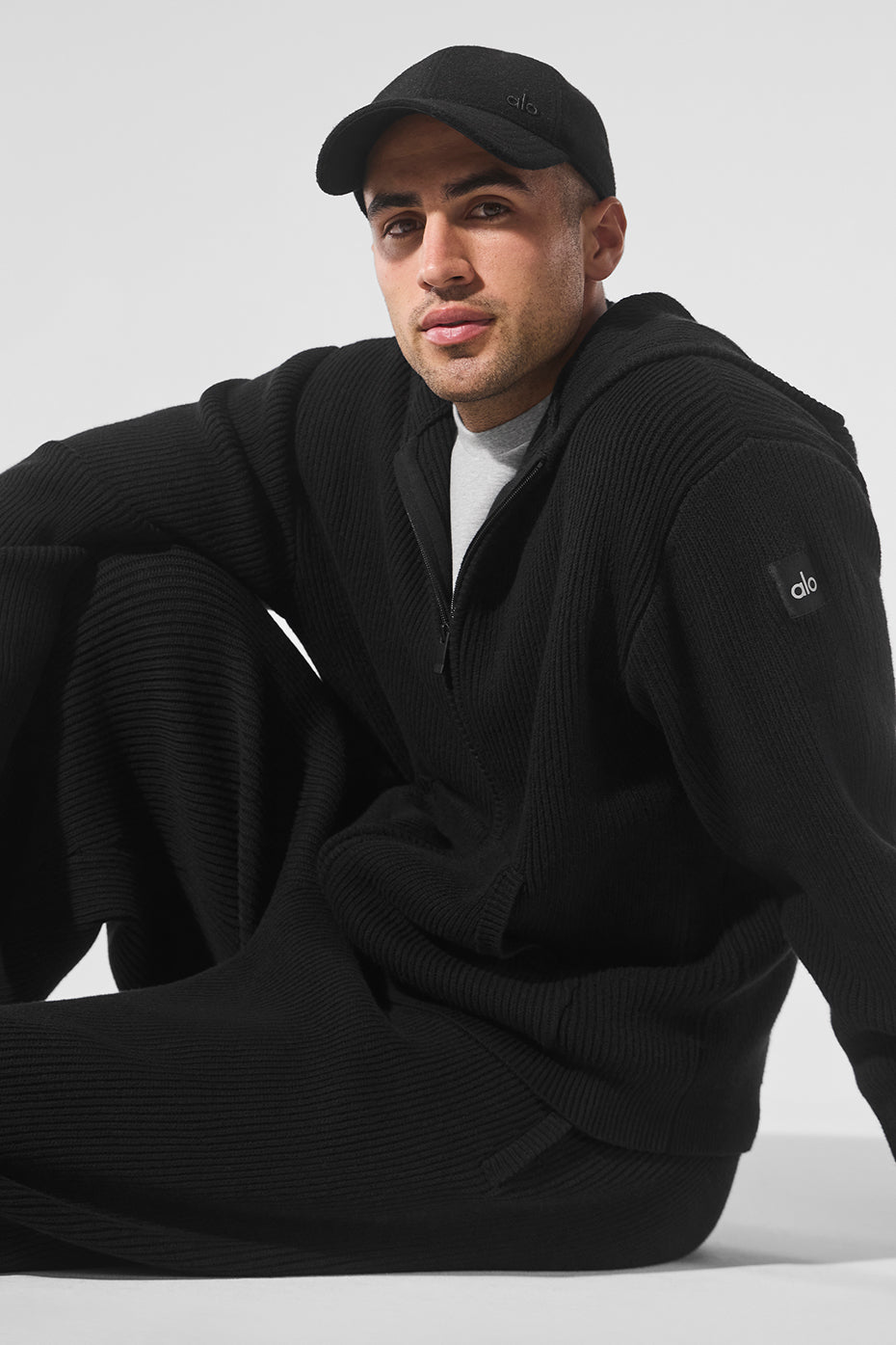 Side view of the mens full zip sweater, highlighting its relaxed fit and stylish design.