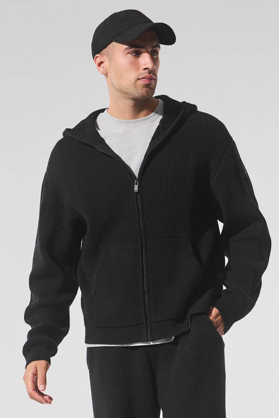 Front view of the oversized cotton sweater in black, showcasing its rib knit texture.