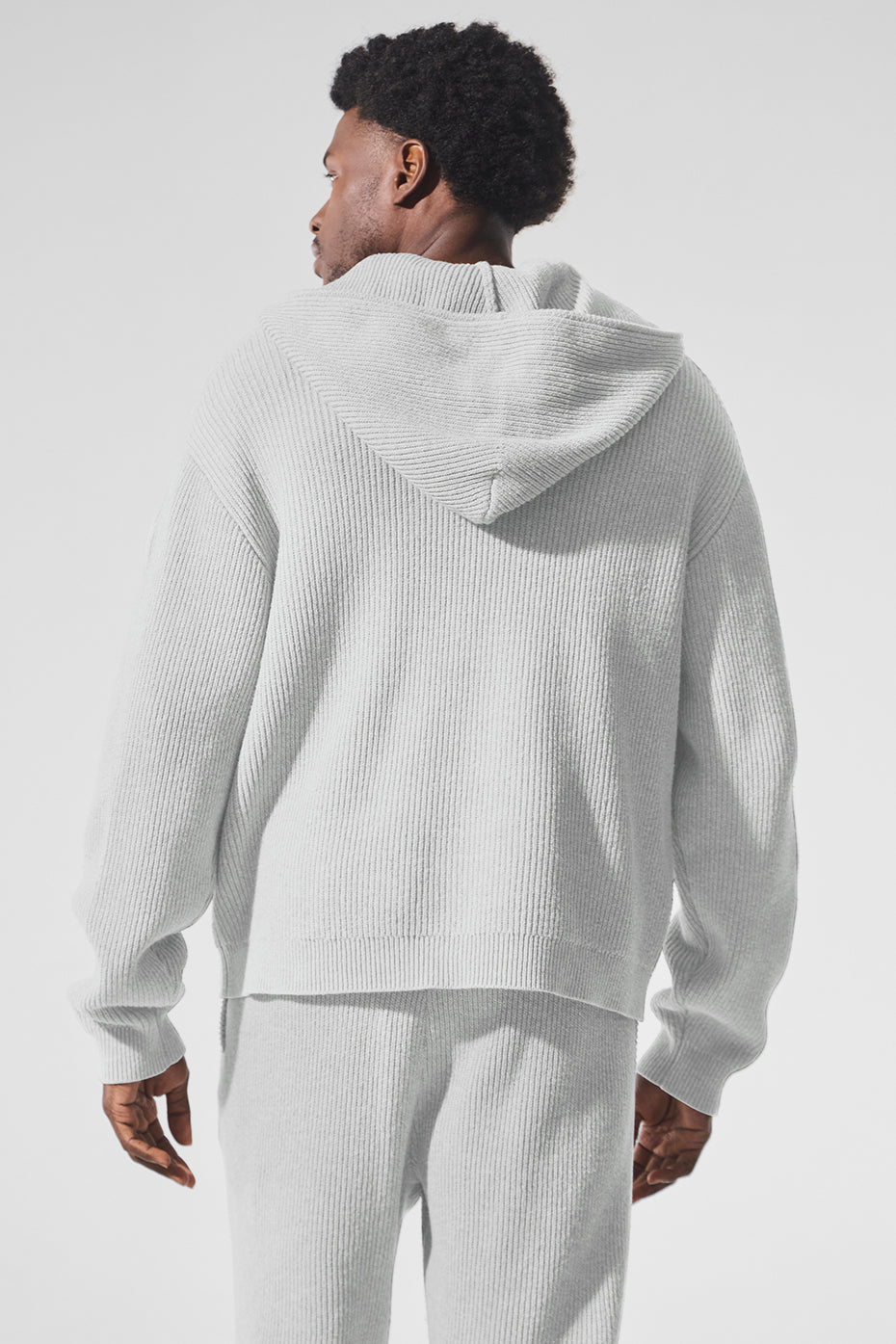 Back view highlighting the soft texture of the oversized cotton sweater.