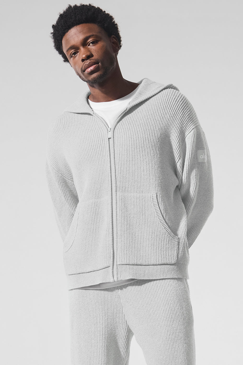 Front view of the oversized rib knit full zip sweater in athletic heather grey.