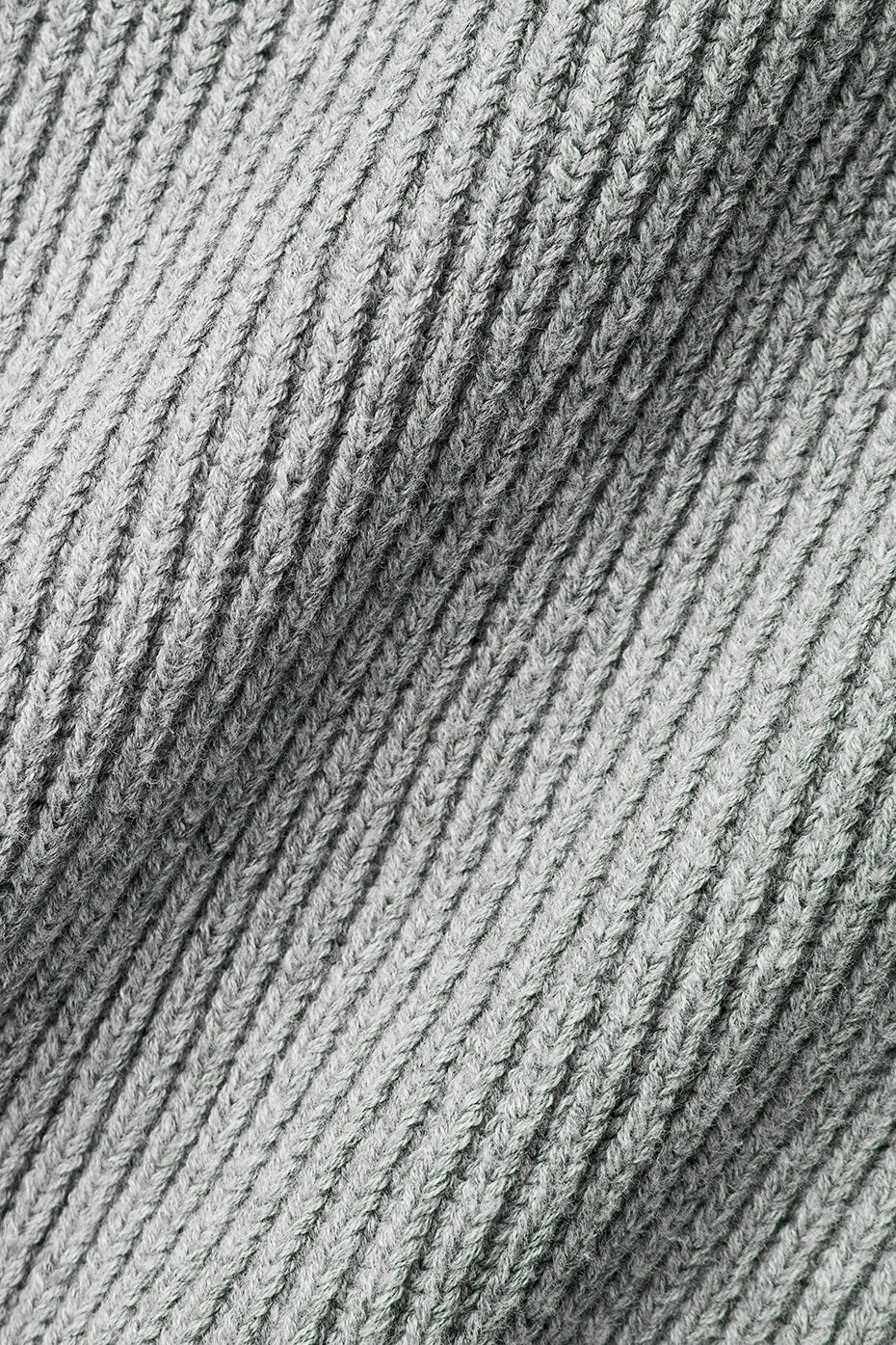 Back view highlighting the soft texture of the oversized cotton sweater.