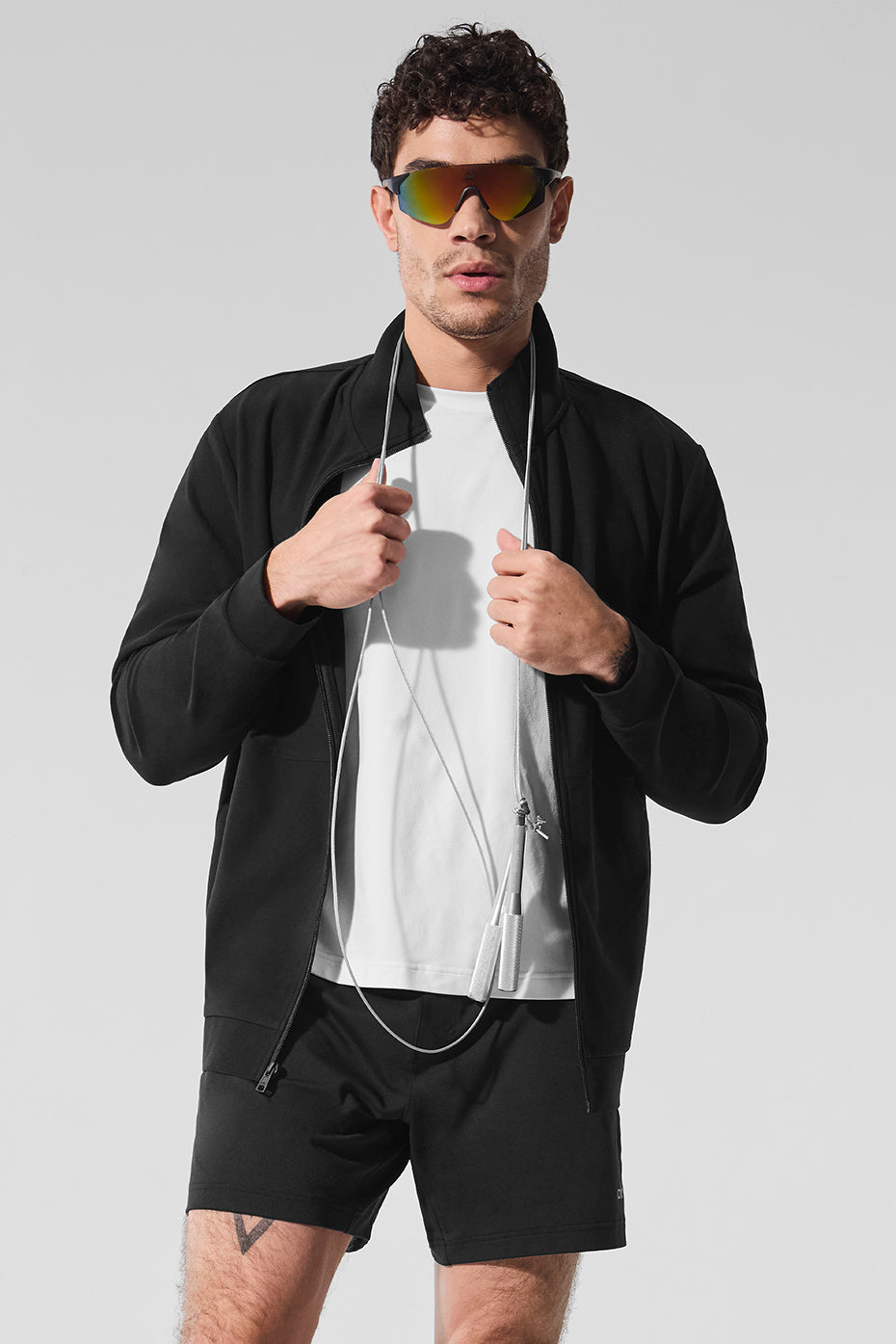 Front view of Conquer Max performance zip top in black.