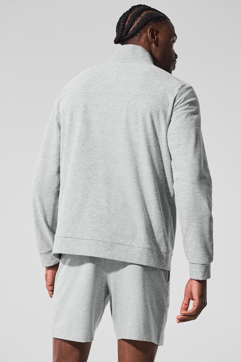 Model wearing the mock neck sweatshirt during an outdoor workout.