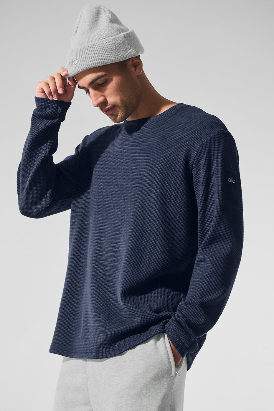 Casual outdoor look wearing white long sleeve shirt beneath navy crew