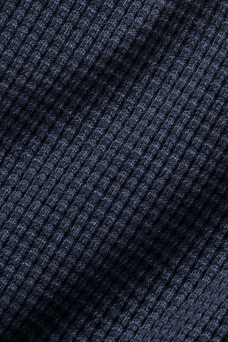 Side angle showing waffle knit top texture in soft lighting
