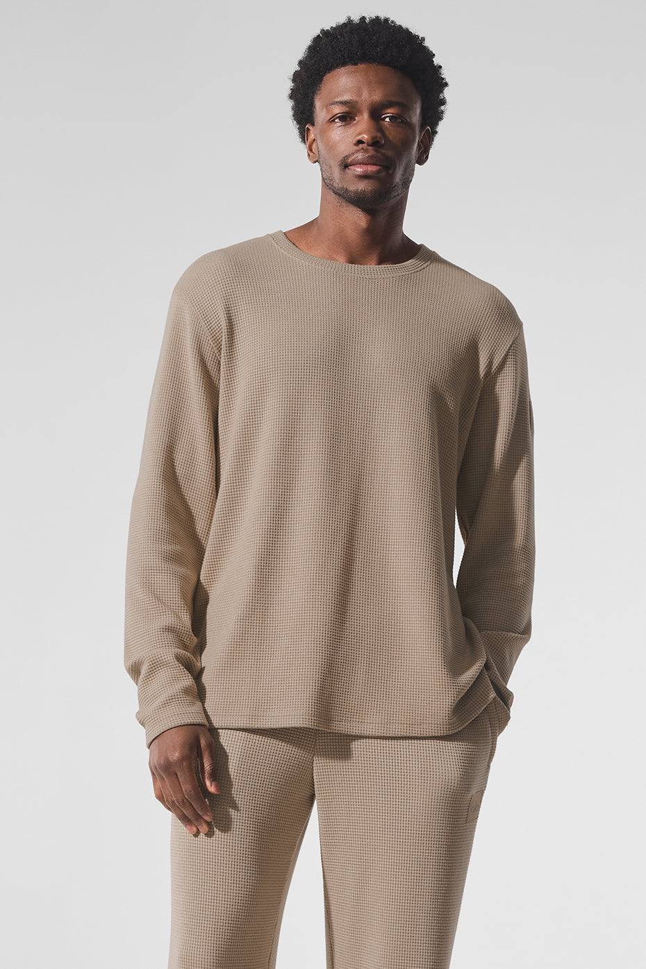 Stylish Elevate Waffle Long Sleeve Crewneck Shirt in Gravel, worn casually.